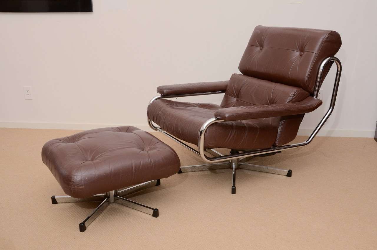 Trendy Amala Dark Grey Leather Reclining Swivel Chair Ottoman Living Spaces Within Amala Dark Grey Leather Reclining Swivel Chairs (View 12 of 20)