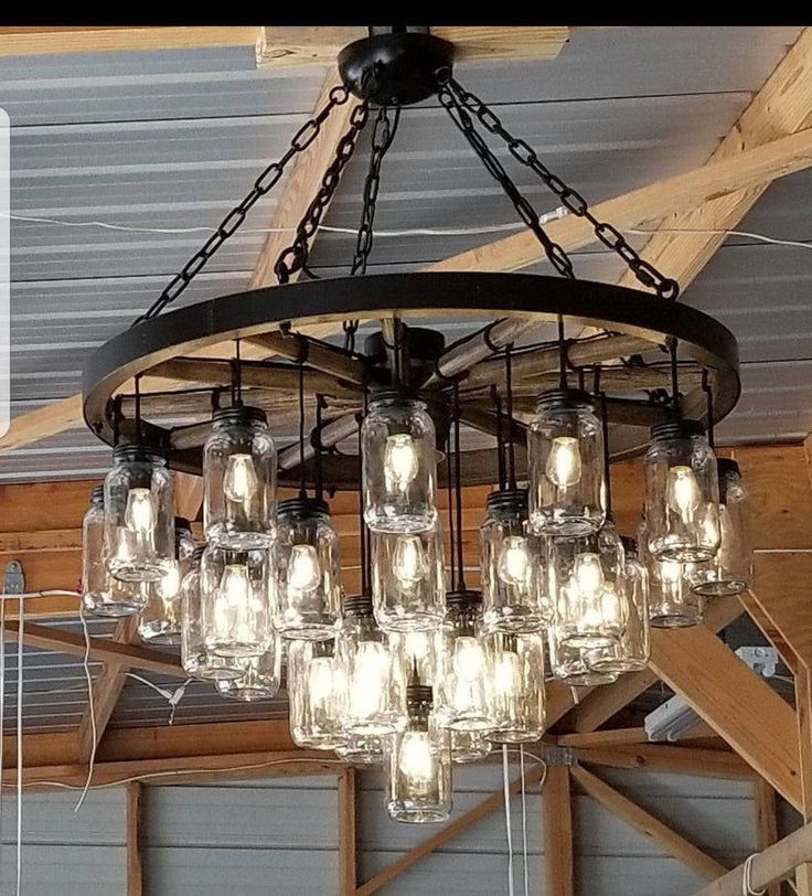 Best And Newest A Wagon Wheel Chandelier With A Mix Of Rustic/vintage Inside Wagon Wheel Chandeliers (View 5 of 20)