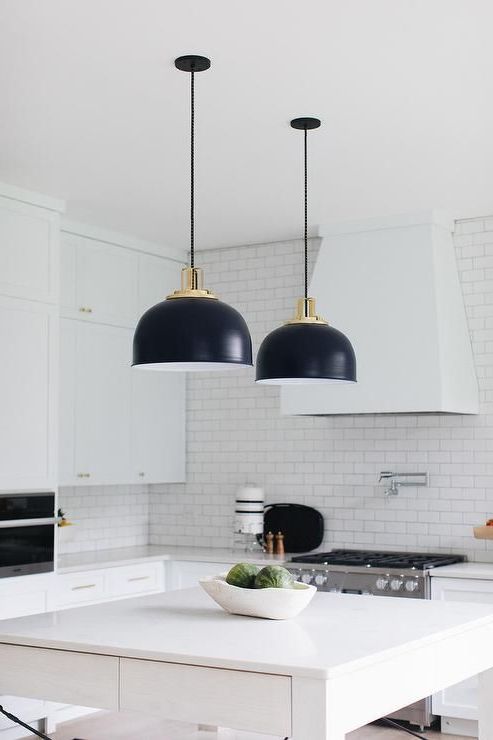 Black Industrial Lights Over A White Kitchen Island Topped For Best And Newest Black And Gold Kitchen Island Light Pendant (View 16 of 20)