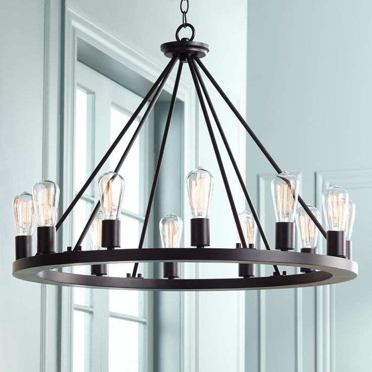 Black Wagon Wheel Ring Chandeliers Within 2020 Lacey 28" Wide Round Black 12 Light Led Wagon Wheel (View 6 of 20)