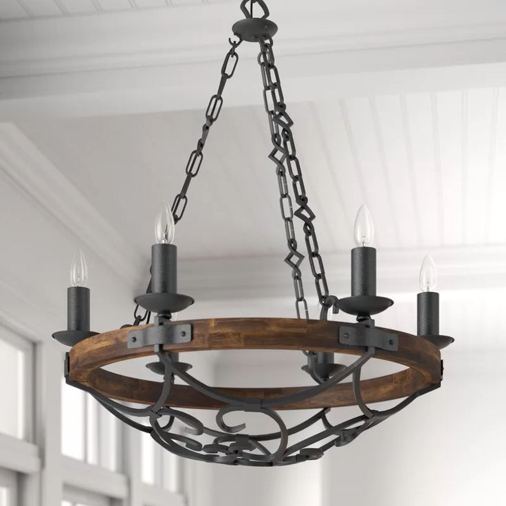 Brass Wagon Wheel Chandeliers With Regard To Fashionable Three Posts Bacchus 6 Light Candle Style Wagon Wheel (View 9 of 20)