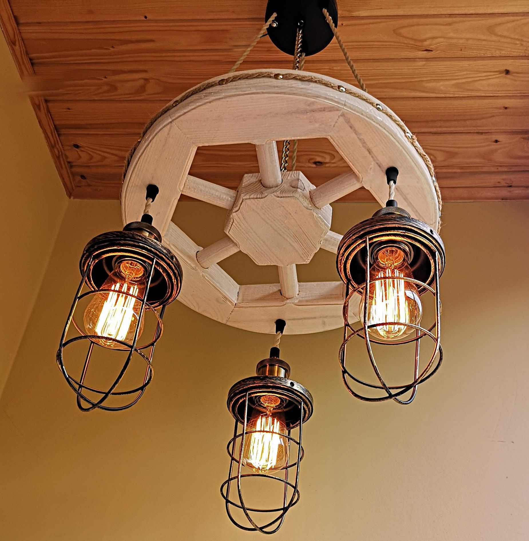 Most Recently Released Wagon Wheel Chandeliers Intended For Handmade Rustic Wood Wagon Wheel Chandelier (View 1 of 20)