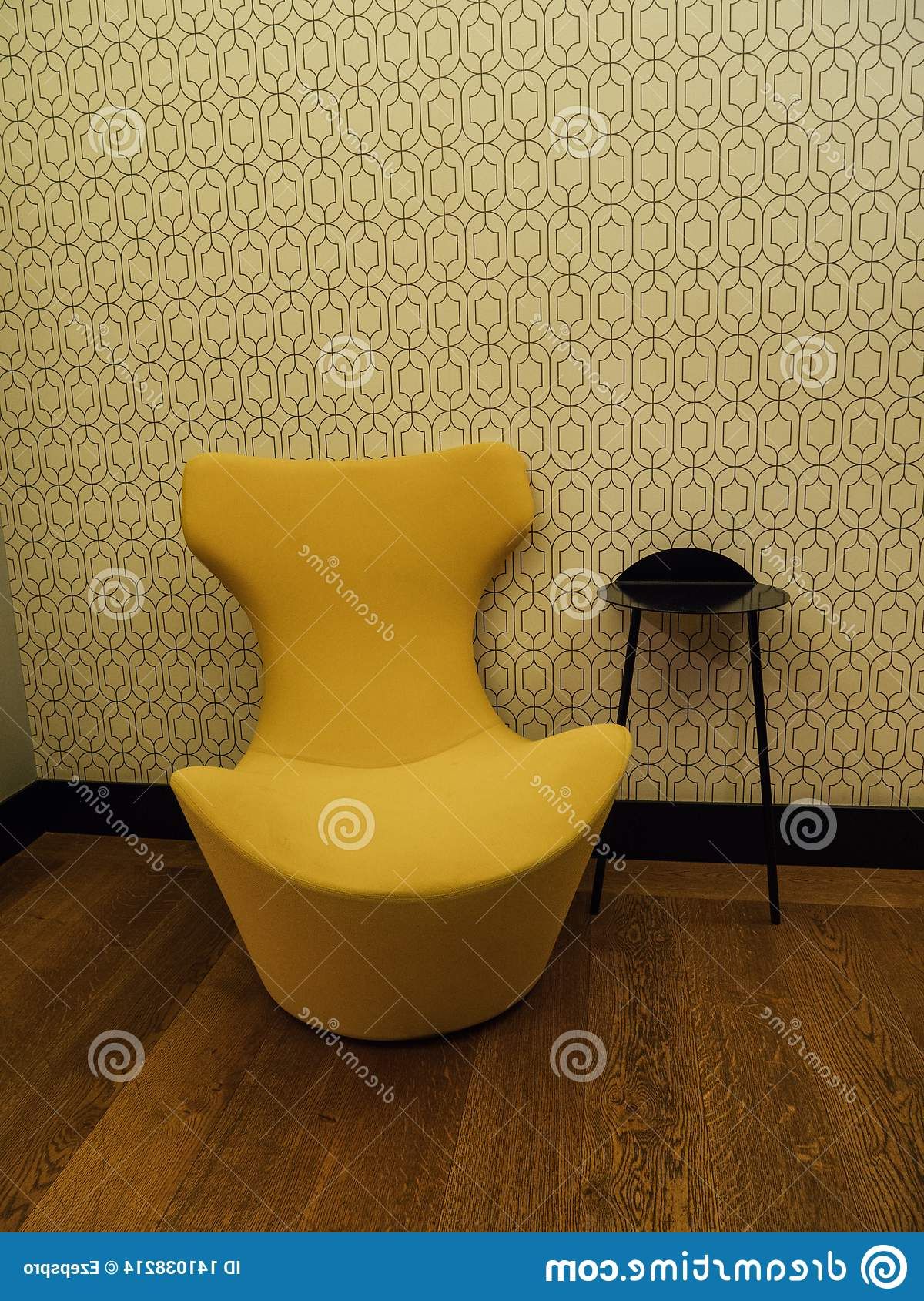 Popular Yellow And Black Coffee Tables In Yellow Design Sofa Next To Black Coffee Table Stock Photo (View 20 of 20)