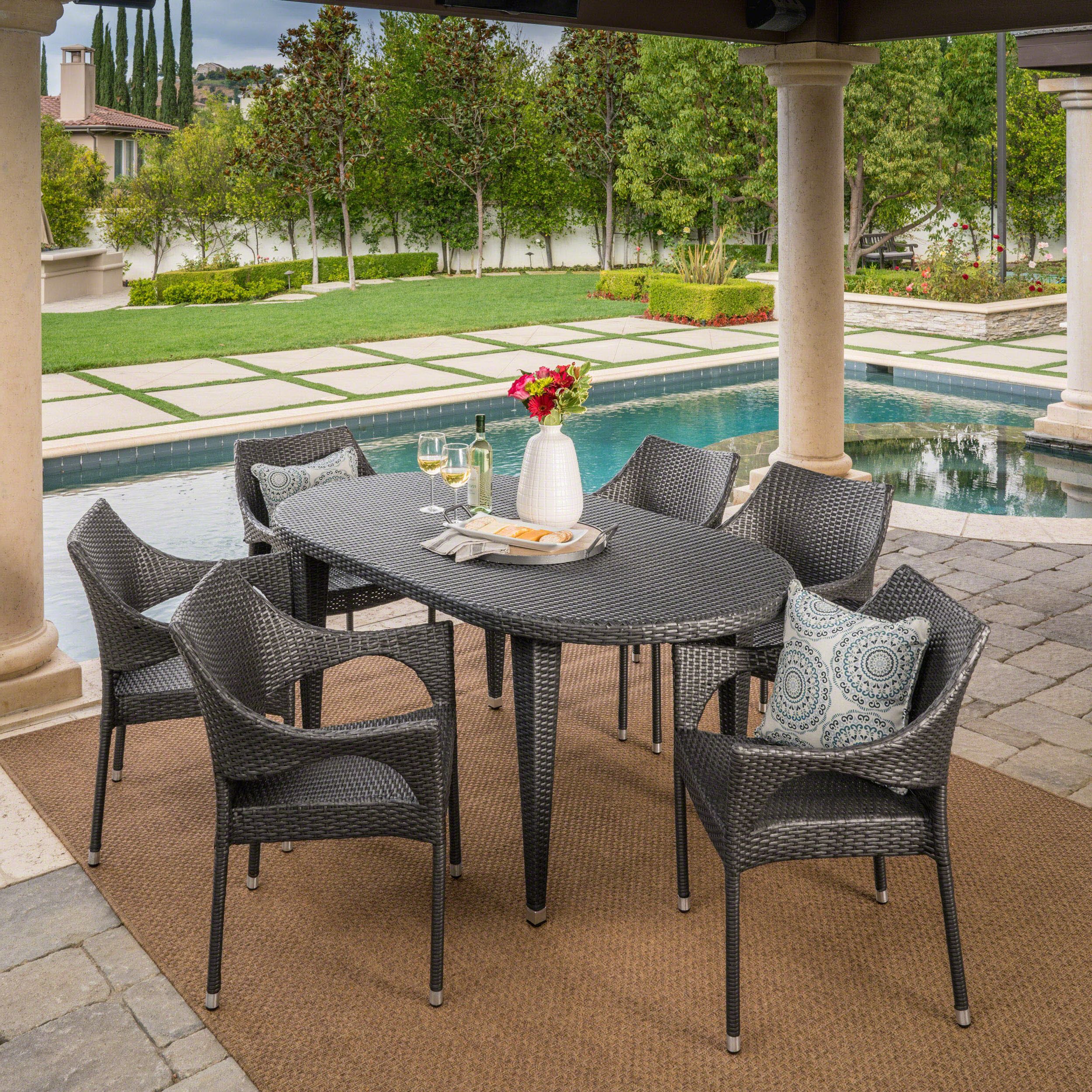 2020 Oval 7 Piece Outdoor Patio Dining Sets Intended For Analia Outdoor 7 Piece Wicker Oval Dining Set With Stacking Chairs (View 1 of 15)