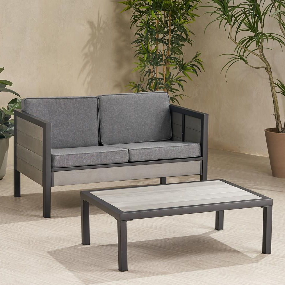 Gray Wood Outdoor Conversation Sets Intended For Best And Newest Noble House Jax Grey 2 Piece Faux Wood Patio Conversation Seating Set (View 12 of 15)